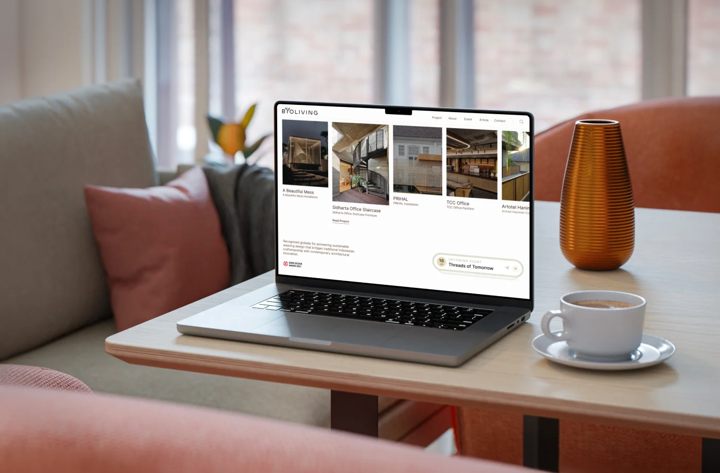 The BYO Living website on a laptop, opening on a row of project covers with the upcoming event pinned in the corner